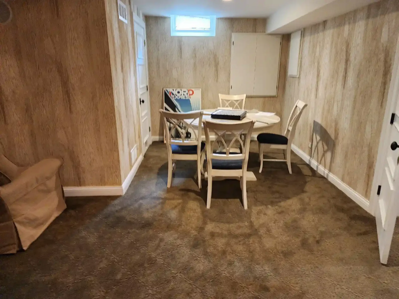 Interior with patterned wallpaper used as a room design feature